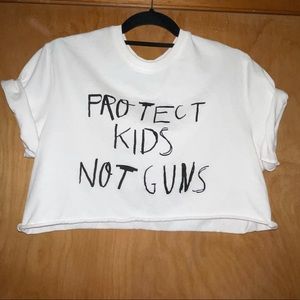 PROTECT KIDS NOT GUNS chnge organic cotton cropped tee